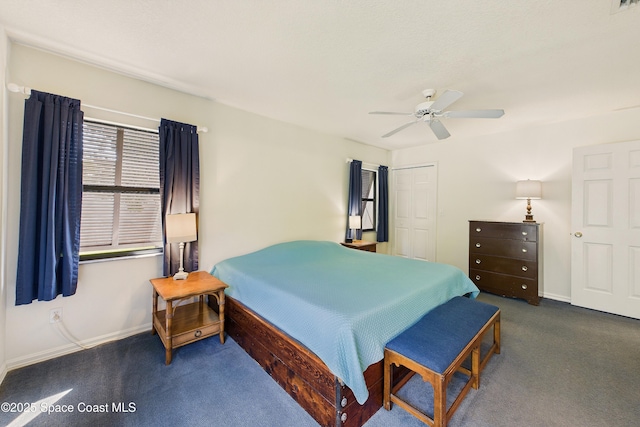 bedroom with carpet, baseboards, ceiling fan, and a closet