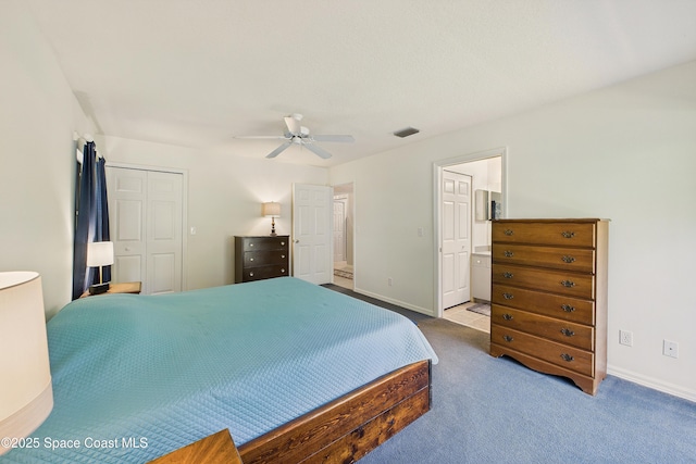 carpeted bedroom with ensuite bathroom, ceiling fan, visible vents, baseboards, and a closet