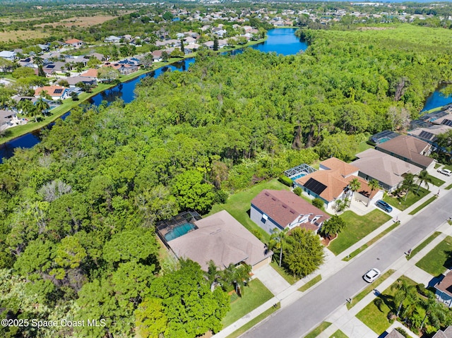 birds eye view of property featuring a residential view and a water view