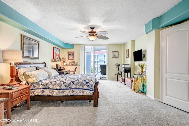 bedroom featuring access to exterior, carpet flooring, ceiling fan, a textured ceiling, and baseboards