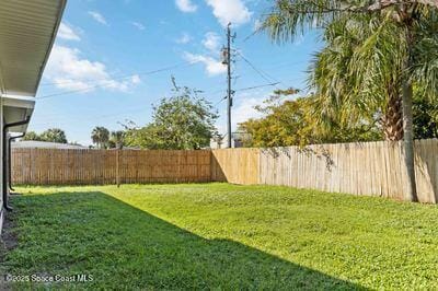 view of yard with a fenced backyard