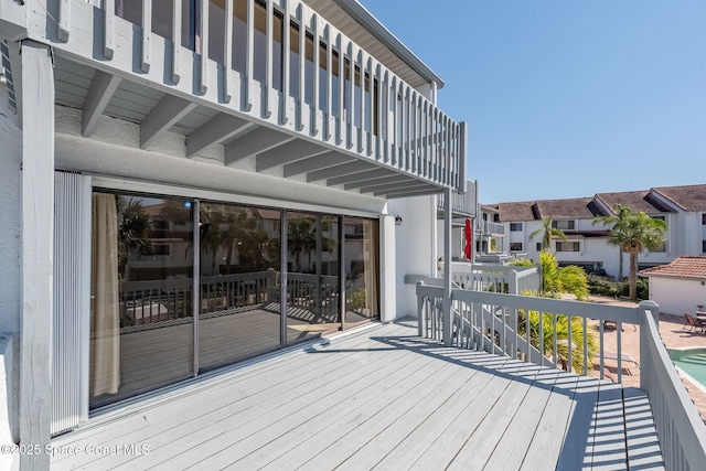 wooden terrace featuring a residential view