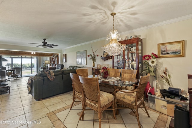 dining space with ornamental molding, ceiling fan with notable chandelier, and light tile patterned floors