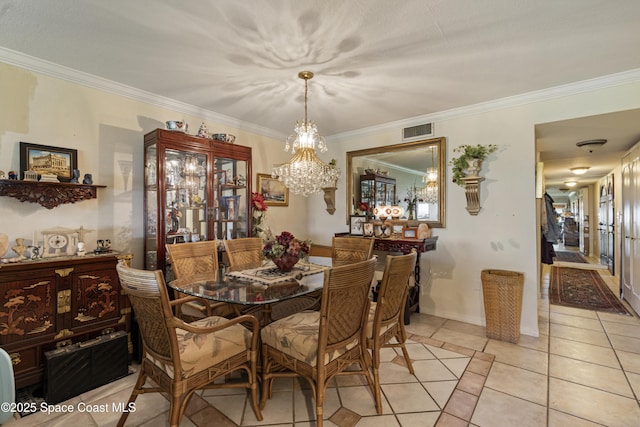 dining area featuring light tile patterned floors, baseboards, visible vents, and crown molding