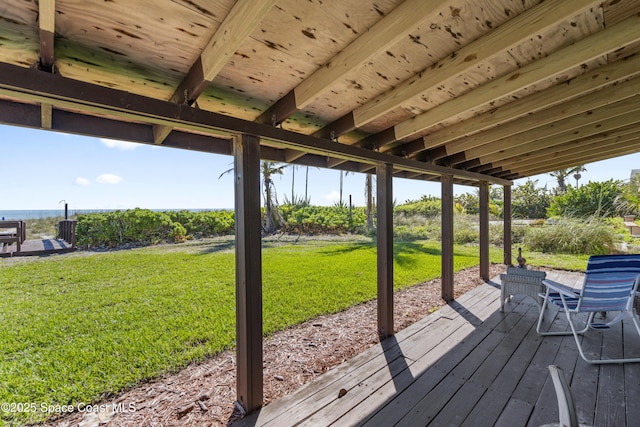 wooden deck featuring a yard