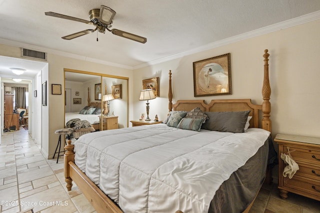 bedroom with visible vents, a ceiling fan, crown molding, a textured ceiling, and a closet