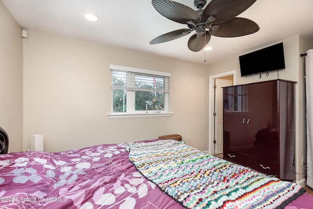 bedroom with ceiling fan and recessed lighting