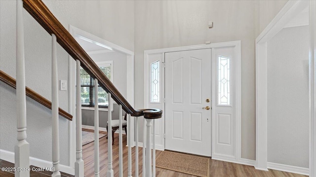 3794 Rambling Acres Dr, Titusville, FL 32796 - entryway featuring stairs, light wood finished floors, and baseboards