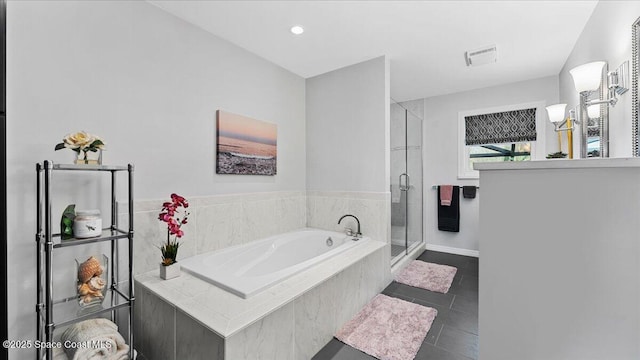 3794 Rambling Acres Dr, Titusville, FL 32796 - bathroom with a stall shower, visible vents, a garden tub, and tile patterned floors