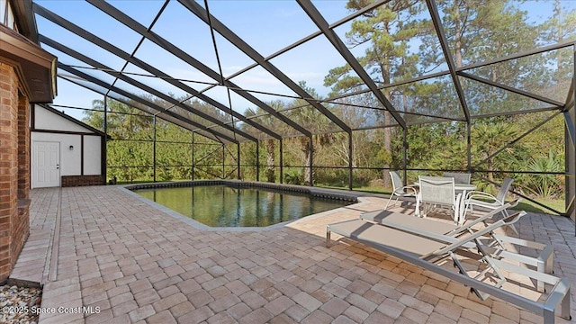 3794 Rambling Acres Dr, Titusville, FL 32796 - outdoor pool featuring a patio, outdoor dining area, and glass enclosure