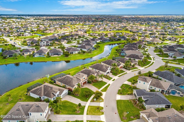 aerial view with a water view and a residential view