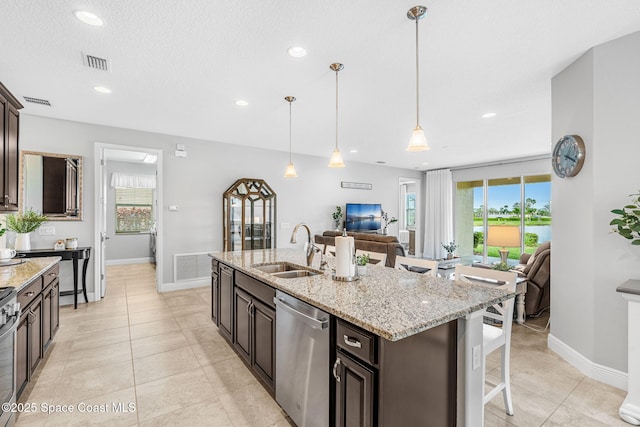 kitchen with stainless steel appliances, a sink, visible vents, and a healthy amount of sunlight