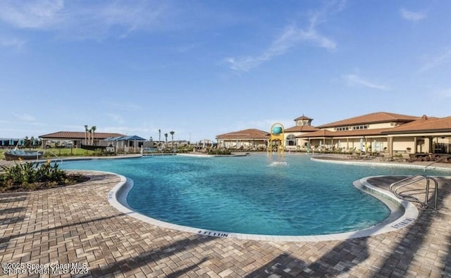 community pool with a patio