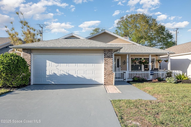 ranch-style home featuring brick siding, covered porch, concrete driveway, and an attached garage