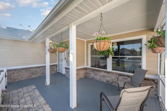 view of patio featuring a porch