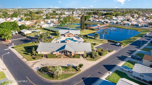 birds eye view of property featuring a residential view and a water view