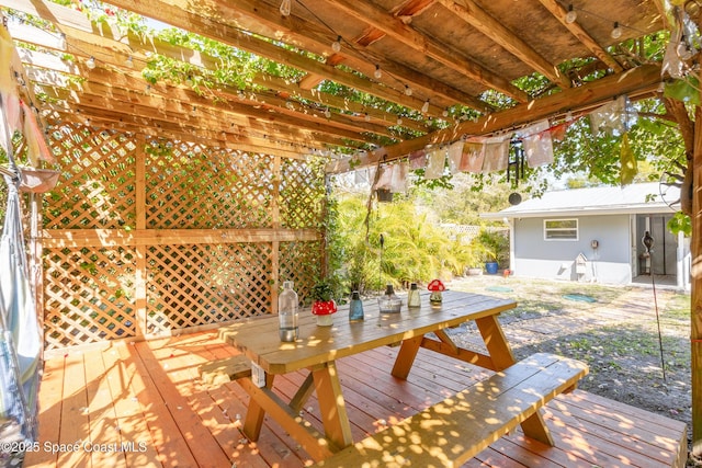 wooden deck featuring outdoor dining area