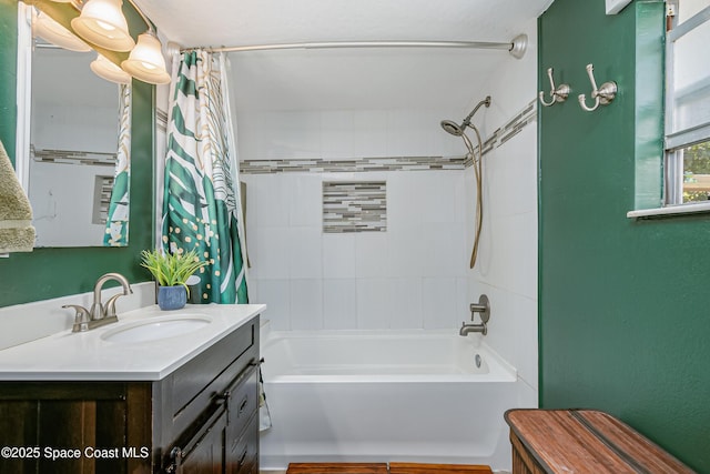 bathroom with shower / bath combo with shower curtain and vanity