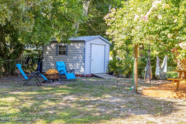 view of shed featuring a fire pit