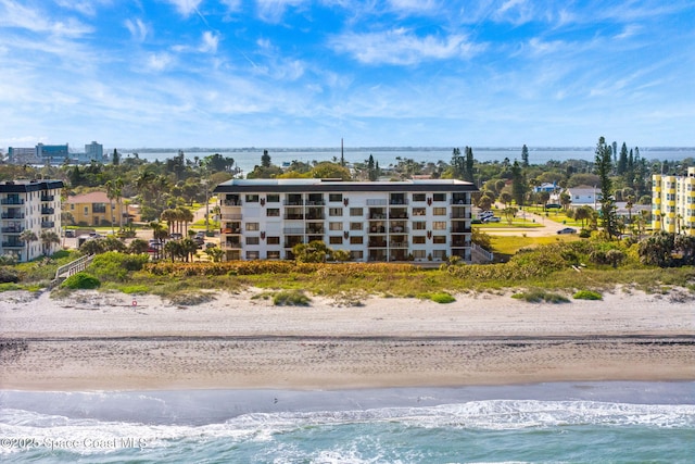 drone / aerial view with a view of the beach and a water view