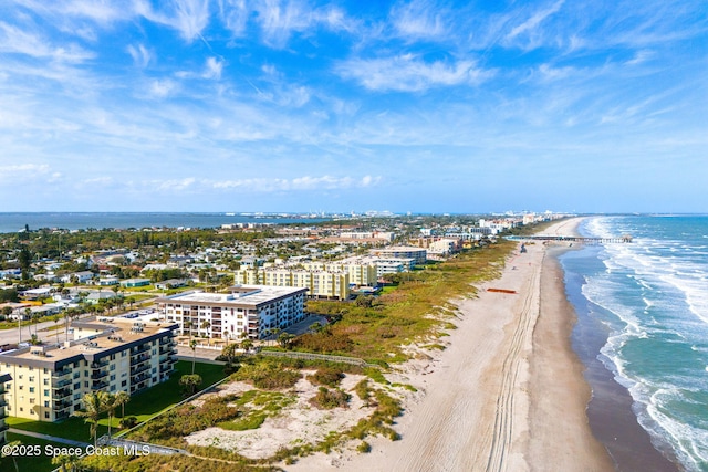 aerial view with a water view, a beach view, and a city view