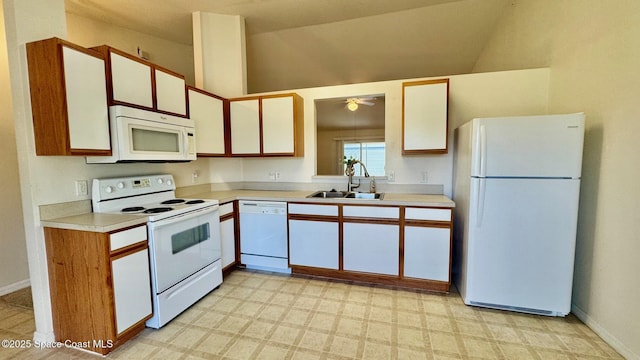 kitchen featuring ceiling fan, white appliances, a sink, light countertops, and light floors