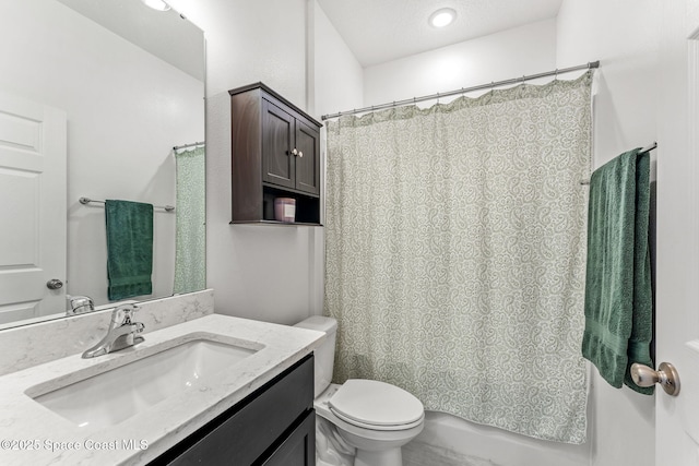 bathroom featuring shower / bathtub combination with curtain, vanity, and toilet