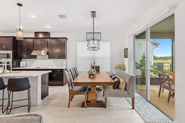 dining room featuring visible vents, a chandelier, and recessed lighting