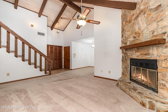 unfurnished living room featuring wooden ceiling, carpet, a fireplace, and visible vents