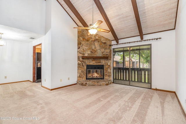 unfurnished living room featuring carpet floors, a stone fireplace, high vaulted ceiling, and beam ceiling