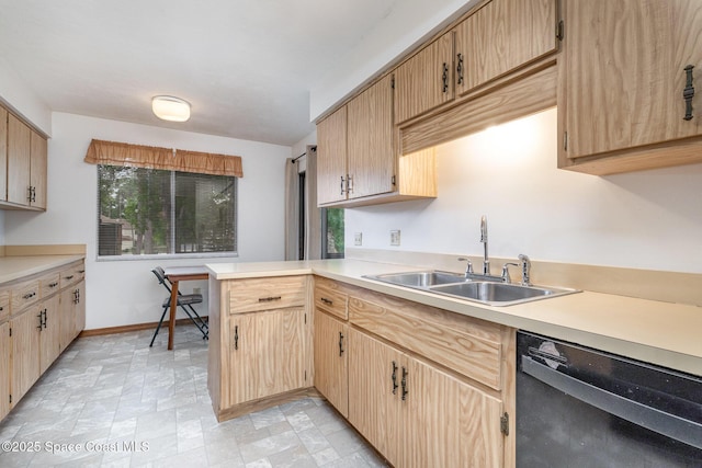 kitchen with a sink, a peninsula, light countertops, and dishwasher