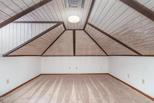 bonus room with wooden ceiling, carpet flooring, vaulted ceiling, and baseboards