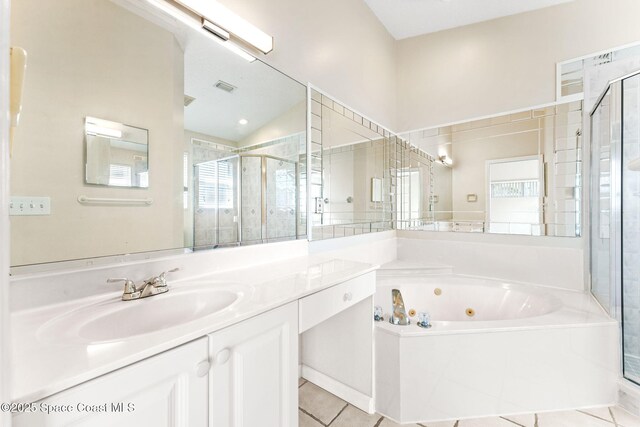 full bathroom featuring visible vents, vanity, a shower stall, a whirlpool tub, and tile patterned floors