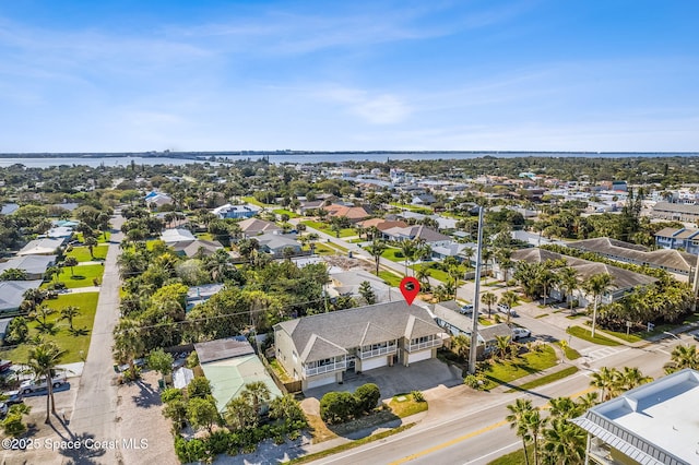 birds eye view of property with a water view and a residential view