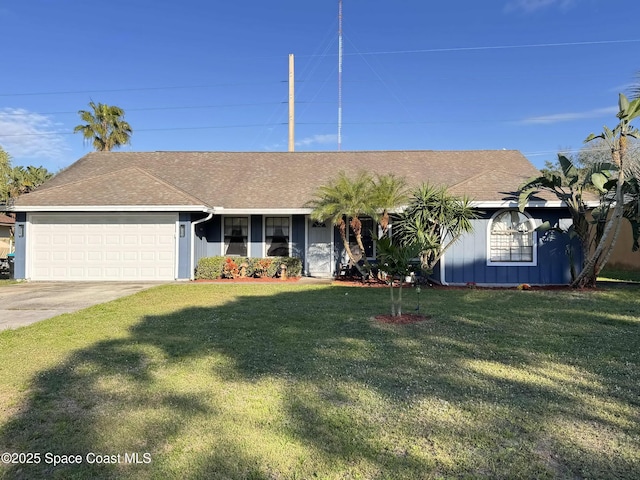 ranch-style house featuring a garage, roof with shingles, driveway, and a front lawn