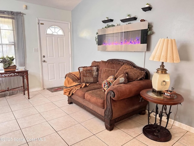 tiled living area featuring baseboards