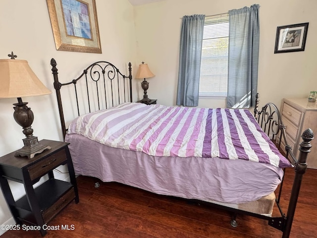 bedroom with wood finished floors