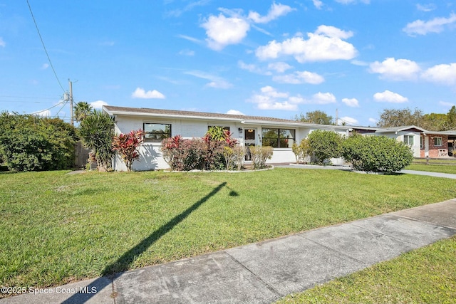 ranch-style house with a front lawn