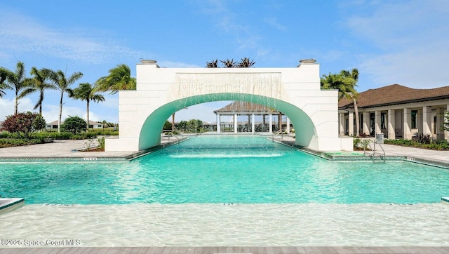 community pool featuring a patio area