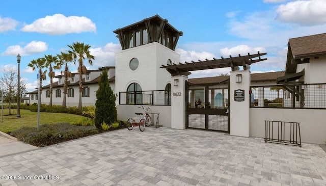 view of building exterior featuring a fenced front yard