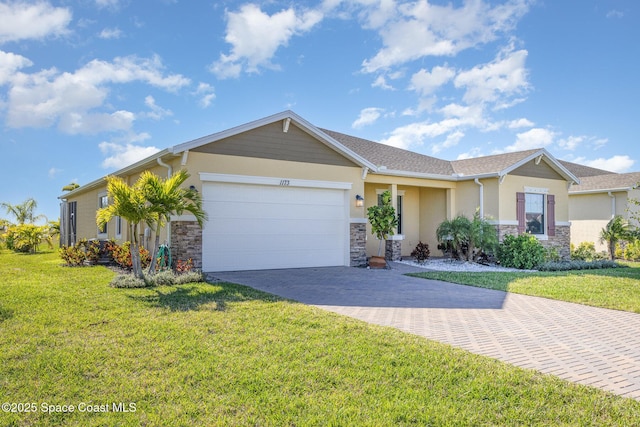 ranch-style house with stucco siding, a front lawn, decorative driveway, stone siding, and an attached garage