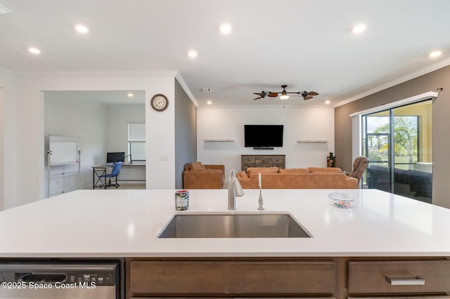 kitchen with a center island with sink, a sink, light countertops, stainless steel dishwasher, and open floor plan