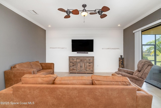 living room with crown molding, a ceiling fan, visible vents, and baseboards