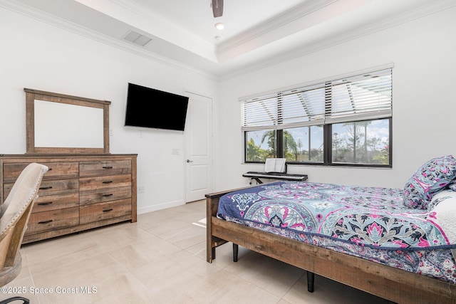 bedroom with visible vents, a tray ceiling, light tile patterned flooring, crown molding, and baseboards