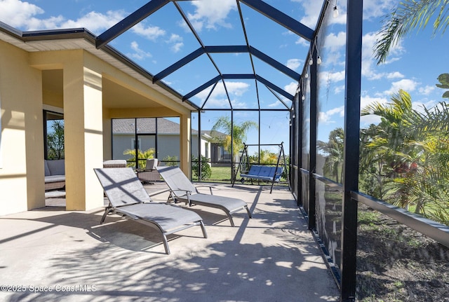 view of patio with a lanai