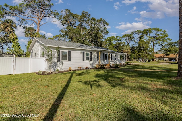 view of front of house with fence and a front yard