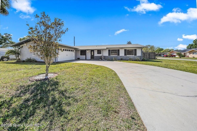 ranch-style home with a garage, concrete driveway, a front yard, and fence