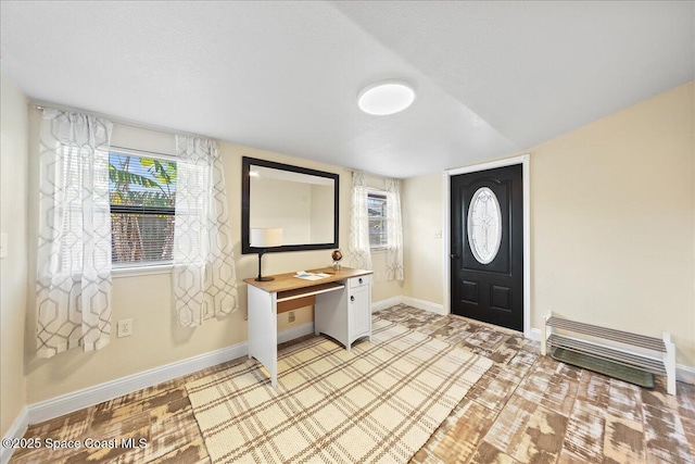 entrance foyer featuring baseboards