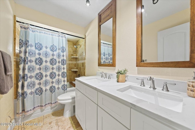 bathroom featuring double vanity, toilet, shower / bath combo, and a sink