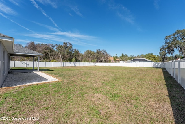 view of yard with a fenced backyard and a patio